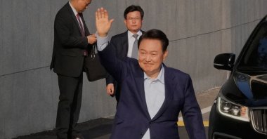 Ousted South Korean president Yoon Suk Yeol waves before leaving the presidential residence in Seoul, South Korea, April 11, 2025. (AFP Photo)