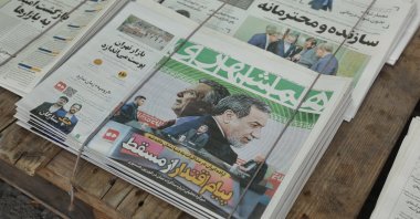 A copy of Iranian daily newspaper Hamshahri entitled "Message of power from Muscat" carrying a picture of Iranian Foreign Minister Abbas Araghchi and U.S. Special Envoy to the Middle East Steve Witkoff, in a kiosk in Tehran, Iran, April 13, 2025. (EPA Photo)