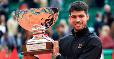 Spain&#039;s Carlos Alcaraz celebrates with the Monte Carlo Masters trophy in Roquebrune-Cap-Martin, Monte Carlo, April 13, 2025. (AFP Photo)