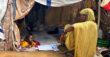 A displaced Sudanese woman rests inside a shelter at Zamzam camp, North Darfur, Sudan, Aug. 1, 2024. (Reuters Photo)