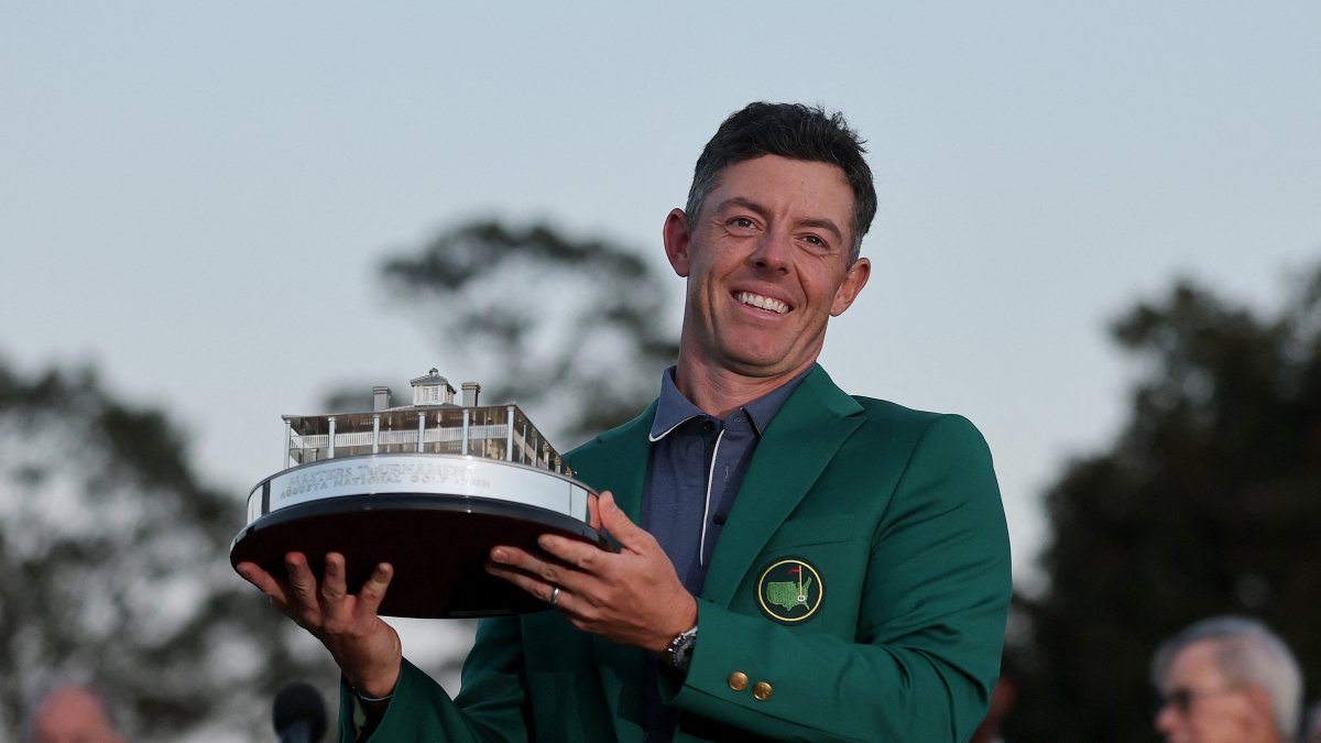 Northern Ireland&#039;s Rory McIlroy poses with the Masters trophy during the Green Jacket Ceremony after winning the 2025 Masters Tournament at Augusta National Golf Club, Augusta, U.S., April 13, 2025. (AFP Photo)