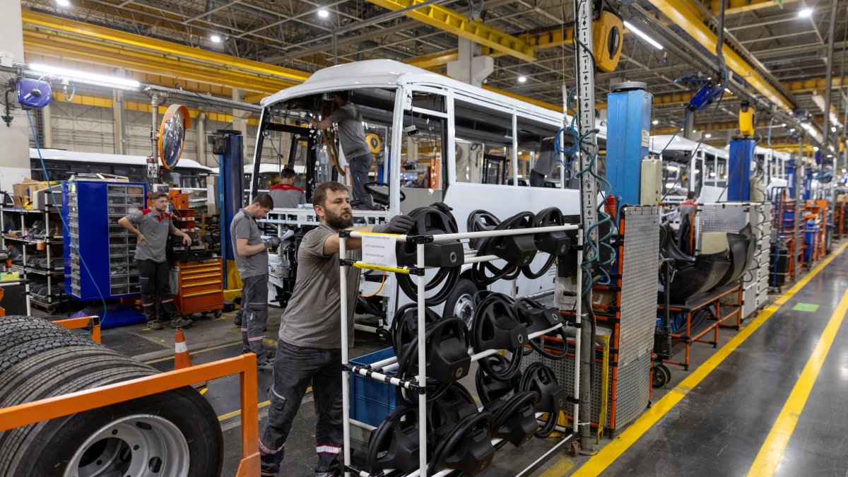 Technicians work on a bus at a production line of Türkiye&#039;s heavy commercial and armored vehicle manufacturer Otokar factory, Arifiye, Sakarya, northwestern Türkiye, July 13, 2023. (Reuters Photo)