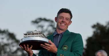 Northern Ireland&#039;s Rory McIlroy poses with the Masters trophy during the Green Jacket Ceremony after winning the 2025 Masters Tournament at Augusta National Golf Club, Augusta, U.S., April 13, 2025. (AFP Photo)