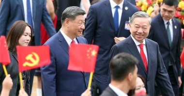 Vietnam's General Secretary of the Communist Party To Lam (R) receives China's President Xi Jinping (C) during a ceremonial welcome at the Presidential Palace, Hanoi, Vietnam, April 14, 2025. (AFP Photo)