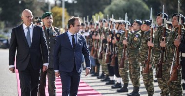 Greek Defense Minister Nikos Dendias (L) and his French counterpart Sebastien Lecornu (R) inspect the honor guard, in Athens, Greece, Apr. 14, 2025. (Reuters Photo)