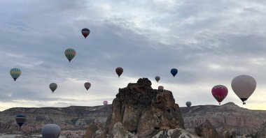 Hot air balloons drift over the unique landscapes of Cappadocia, Türkiye, April 14, 2025. (AA Photo)