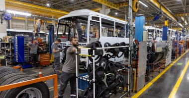 Technicians work on a bus at a production line of Türkiye's heavy commercial and armored vehicle manufacturer Otokar factory, Arifiye, Sakarya, northwestern Türkiye, July 13, 2023. (Reuters Photo)