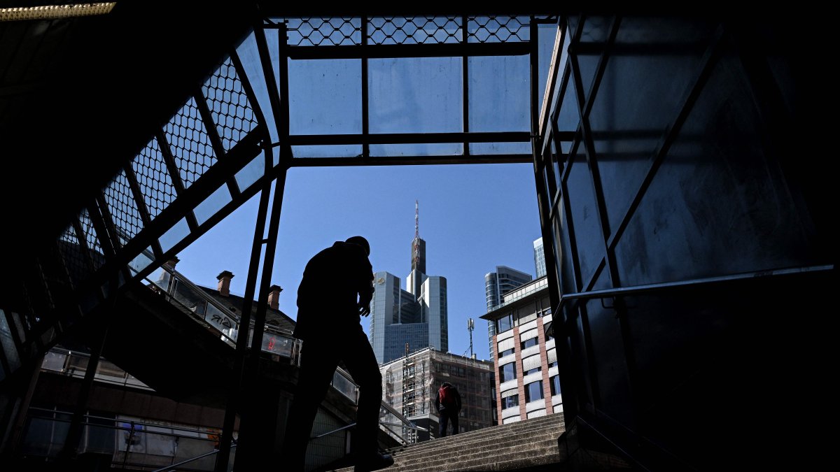 A man leaves an underground passage outside the banking district skyline of Frankfurt, Germany, April 11, 2025. (AFP Photo)
