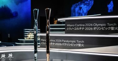 The torches for the Milano Cortina 2026 winter Olympic (L) and Paralympic (R) games are displayed during their unveiling ceremony at the Italy Pavilion, Osaka, Japan, April 14, 2025. (AFP Photo)