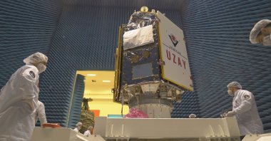 Engineers inspect the IMECE satellite at Vandenberg Space Force Base, California, U.S., April 14, 2023. (AA Photo)