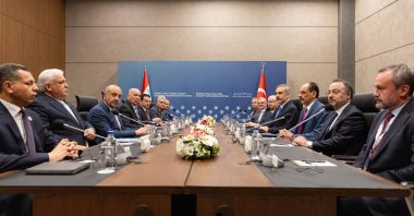 Foreign Minister Hakan Fidan (C-R) and Iraqi Foreign Minister Fuad Hussein (C-L) lead their delegations during the 5th High-Level Security Mechanism meeting, Antalya, Türkiye, April 13, 2025. (AA Photo)