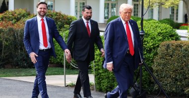 U.S. President Donald Trump and Vice President JD Vance walk with Ohio State coach Ryan Day, as Trump hosts the Ohio State University 2025 College Football National Champions, at the White House, Washington, U.S., April 14, 2025. (Reuters Photo)