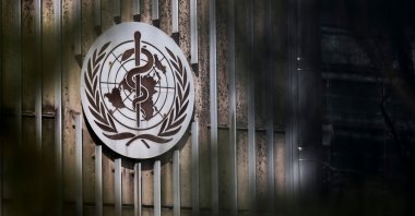 This photo shows a sign of the World Health Organization (WHO) displayed at their headquarters in Geneva, Switzerland, March 13, 2025. (AFP Photo)
