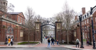 People in front of the main gate to Harvard Yard, in Cambridge, Massachusetts, U.S., April 15, 2025. (AFP Photo)