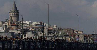 People fish from the Galata Bridge during a sunny day in Istanbul, Türkiye, April 5, 2025. (Reuters Photo)