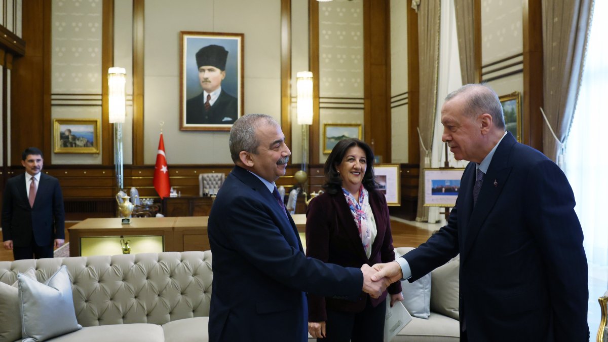 Sırrı Süreyya Önder (L) shakes hands with President Recep Tayyip Erdoğan, Ankara, Türkiye, April 10, 2025. (İHA Photo)