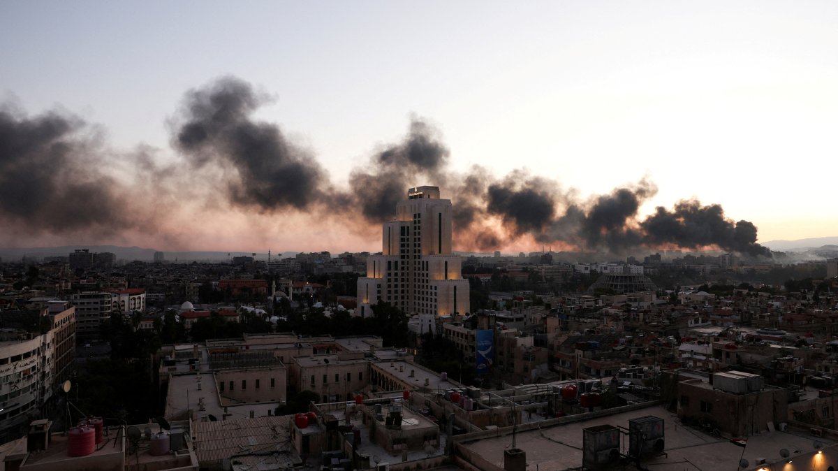 Smoke rises, after Syrian anti-regime forces announced that they have ousted Syria&#039;s Bashar Assad, in Damascus,  Syria, Dec. 8, 2024. (Reuters Photo)