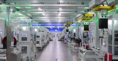 Employees work on the production line of lithium batteries at the workshop of Chu Neng New Energy, Yichang, China,  April 4, 2025. (Reuters Photo)
