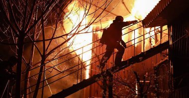 A rescuer working at the site of a Russian drone attack in Dnipro, Ukraine, April 17, 2025. (AFP Photo) 