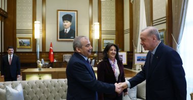 Sırrı Süreyya Önder (L) shakes hands with President Recep Tayyip Erdoğan, Ankara, Türkiye, April 10, 2025. (İHA Photo)