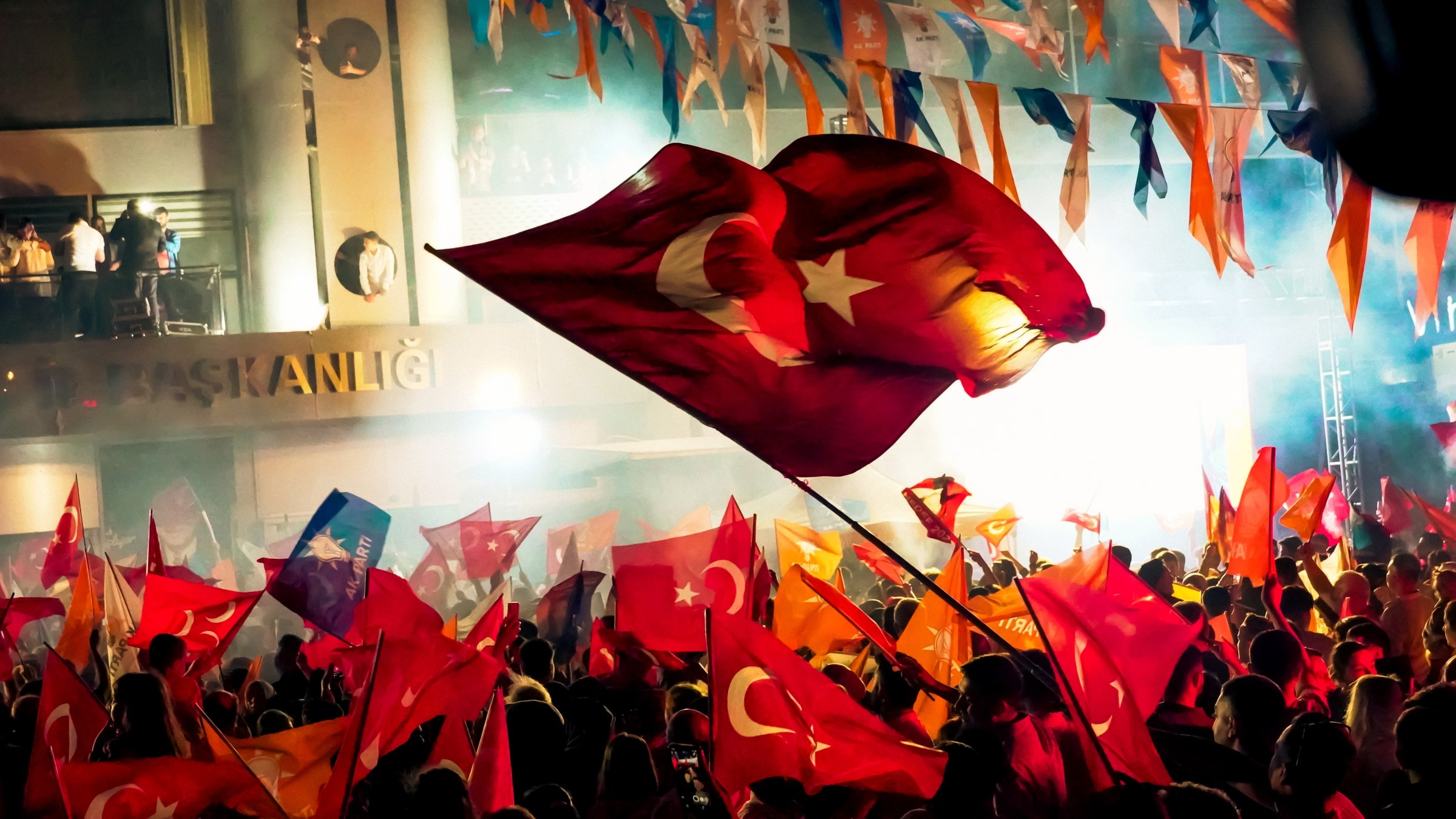 Ruling Justice and Development Party (AK Party) supporters celebrate an election victory in front of the party&#039;s provincial office in İzmir, western Türkiye, May 28, 2023. (Shutterstock Photo)