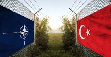 NATO (L) and Turkish flags hang on a fence at a border, Bavaria, Germany, Nov. 11, 2024. (Reuters Photo)