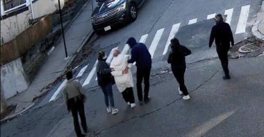 In this image taken from security camera video, Rümeysa Öztürk, a 30-year-old doctoral student at Tufts University, is detained by masked Department of Homeland Security agents, Somerville, Massachusetts, U.S., March 25, 2025. (AP Photo)