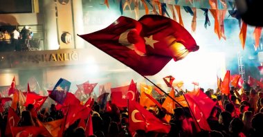Ruling Justice and Development Party (AK Party) supporters celebrate an election victory in front of the party&#039;s provincial office in İzmir, western Türkiye, May 28, 2023. (Shutterstock Photo)