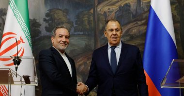 Russia&#039;s Foreign Minister Sergei Lavrov shakes hands with Iran&#039;s Foreign Minister Abbas Araghchi during a joint news conference following their talks in Moscow, April 18, 2025. (AFP Photo)
