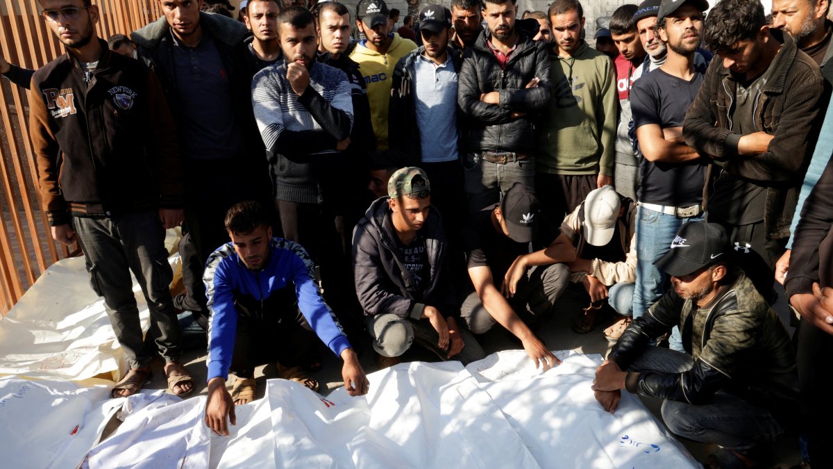 People gather near the bodies of Palestinians killed in Israeli strikes, at Nasser hospital, in Khan Younis, in the southern Gaza Strip, April 19, 2025. (Reuters Photo)