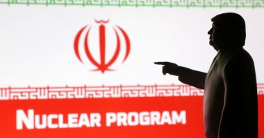 A 3D-printed miniature model depicting U.S. President Donald Trump, Iran flag and a word &amp;quot;Nuclear program&amp;quot; in this illustration taken, April 17, 2025. (Reuters Photo)