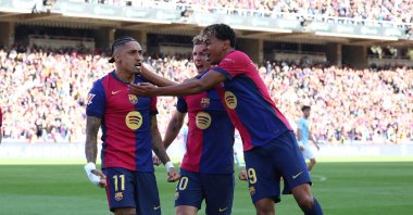 Barcelona's Raphinha (L) celebrates with Lamine Yamal (C) and Dani Olmo after scoring during the La Liga match against Celta Vigo at Estadi Olimpic Lluis Companys, Barcelona, Spain, April 19, 2025. (Reuters Photo)