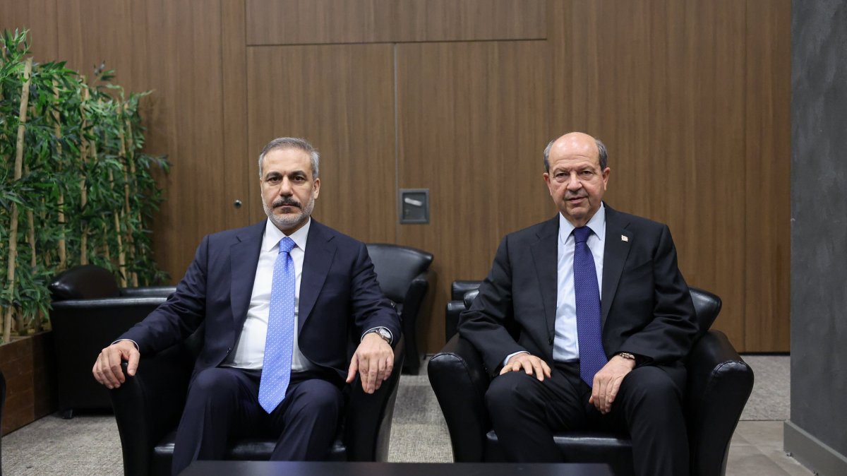 Turkish Cypriot President Ersin Tatar (R) poses with Foreign Minister Hakan Fidan at a meeting, Antalya, southern Türkiye, April 13, 2025. (AA Photo)