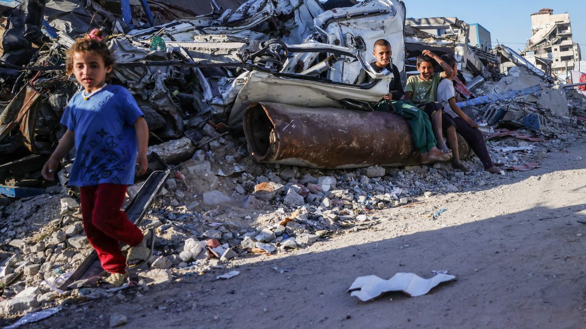 Displaced Palestinian children sit on an unexploded Israeli ordnance in Gaza City, central Gaza, Palestine, April 19, 2025. (AFP Photo)