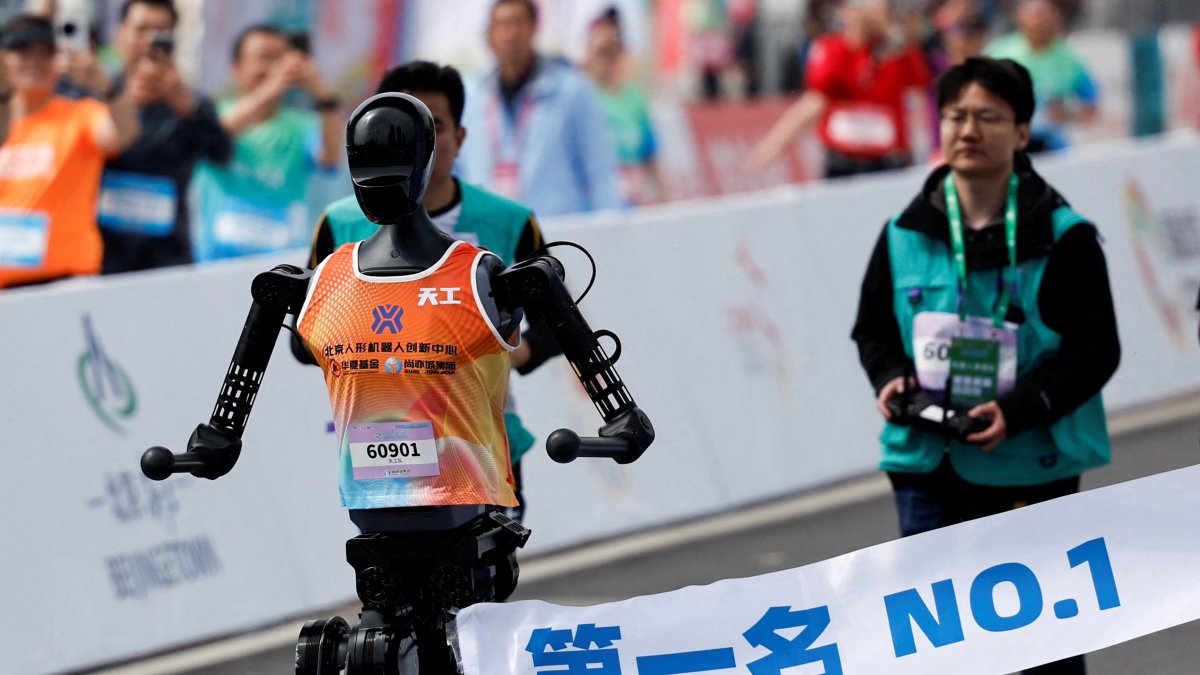Tiangong Ultra, a humanoid robot, runs across the finish line to become first in a humanoid robot half marathon, in Beijing, China, April 19, 2025. (Reuters Photo)