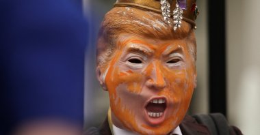 Demonstrator David Barrows wears a mask depicting U.S. President Donald Trump at a rally outside the White House, Washington, U.S., April 19, 2025. (Reuters Photo)