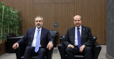 Turkish Cypriot President Ersin Tatar (R) poses with Foreign Minister Hakan Fidan at a meeting, Antalya, southern Türkiye, April 13, 2025. (AA Photo)