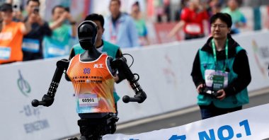 Tiangong Ultra, a humanoid robot, runs across the finish line to become first in a humanoid robot half marathon, in Beijing, China, April 19, 2025. (Reuters Photo)