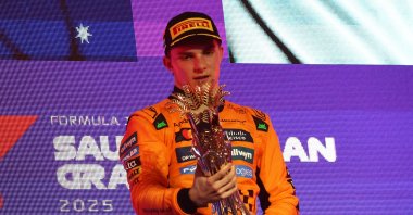McLaren&#039;s Oscar Piastri celebrates with the trophy on the podium after winning the Saudi Arabian Grand Prix at the Jeddah Corniche Circuit, Jeddah, Saudi Arabia, April 20, 2025. (Reuters Photo)