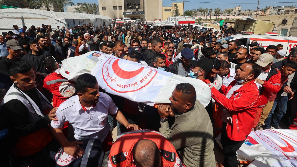 Members of the Palestine Red Crescent and other emergency services carry bodies of fellow rescuers killed a week earlier by Israeli forces, in Khan Younis, southern Gaza Strip, Palestine, March 31, 2025. (AFP Photo)