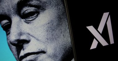 In this photo illustration of Elon Musk, the xAI logo is seen on a mobile device, Yogyakarta, Indonesia, July 16, 2023. (Shutterstock photo)