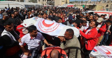 Members of the Palestine Red Crescent and other emergency services carry bodies of fellow rescuers killed a week earlier by Israeli forces, in Khan Younis, southern Gaza Strip, Palestine, March 31, 2025. (AFP Photo)