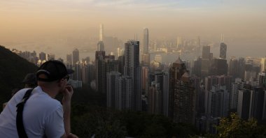 Victoria Harbour and the Central Business District are in a haze as the sun sets over Hong Kong, China, April 14, 2025. (Reuters Photo)