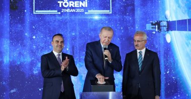 President Recep Tayyip Erdoğan, accompanied by Industry and Technology Minister Mehmet Fatih Kacır (L) and Transport and Infrastructure Minister Abdulkadir Uraloğlu, at the ceremony marking the start of services of the first domestically-made satellite, Türksat 6A, Ankara, Türkiye, April 21, 2025. (AA Photo)
