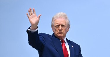 U.S. President Donald Trump waves as he boards Air Force One at Joint Base Andrews in Maryland, U.S., April 3, 2025. (AFP Photo)