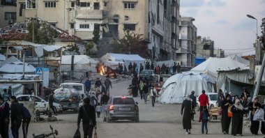 Internally displaced Palestinians walk on the streets of Gaza City, April 14, 2025. (EPA Photo)