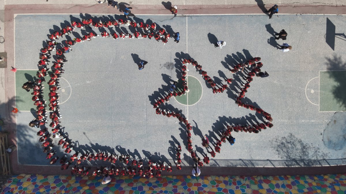 An aerial view shows students forming a crescent and star, symbols of the Turkish flag, during a celebration for National Sovereignty and Children’s Day, Amasya, Türkiye, April 21, 2025. (AA Photo)