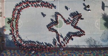 An aerial view shows students forming a crescent and star, symbols of the Turkish flag, during a celebration for National Sovereignty and Children’s Day, Amasya, Türkiye, April 21, 2025. (AA Photo)