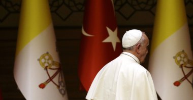Pope Francis leaves at the end of his speech during a meeting with President Recep Tayyip Erdoğan, Ankara, Türkiye, Nov. 28, 2014. (AP Photo)