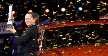 Latvia&#039;s Jelena Ostapenko poses with the trophy and the Porsche Macan Turbo as she celebrates winning the Stuttgart Tennis Grand Prix final against Belarus&#039; Aryna Sabalenka at the Porsche Arena, Stuttgart, Germany, April 21, 2025. (Reuters Photo)